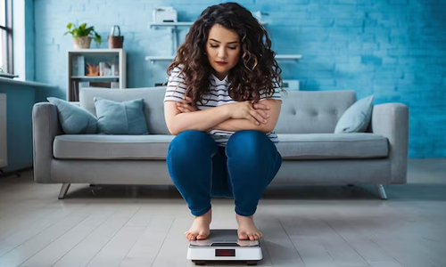 A-woman-worried-about-her-weight