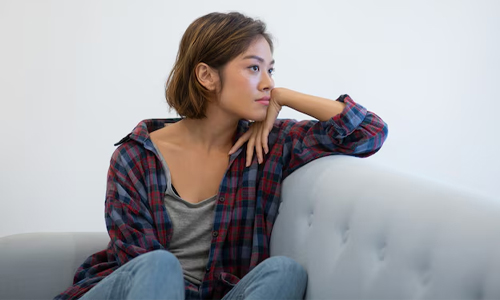 A-woman-sitting-bored