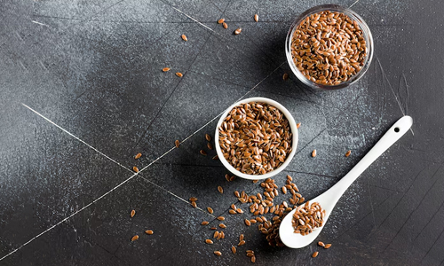 Flax Seeds in two bowls and spoon