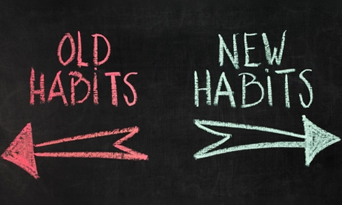 Chalkboard illustration showing the transition from old habits to new habits with directional arrows