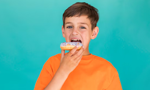 Kid eating a donut