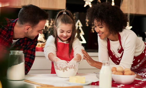 Parents cooking with their kid
