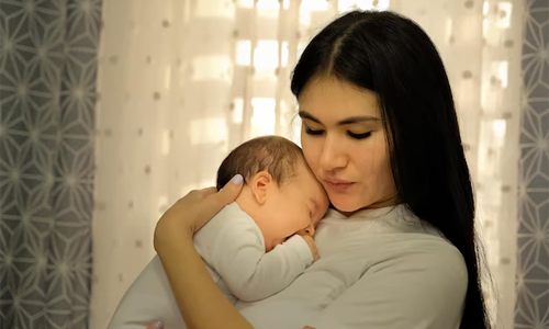 Mother-holding-her-child-in-arms