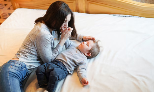 Happy-mother-kissing-her