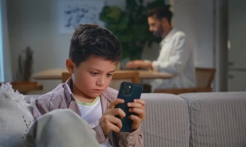 Parent noticing signs of emotional distress in a child using a device
