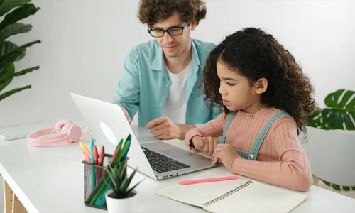 Young student learning safe internet practices on a computer