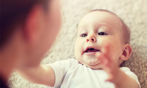 close up image of a happy baby