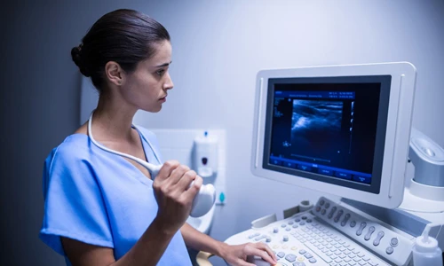 Medical professional using an ultrasonic device for a detailed 20-week anatomy scan.