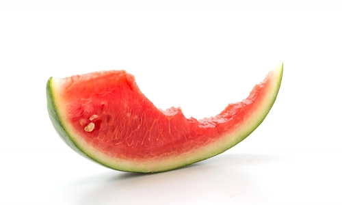 Half eaten fresh watermelon slice in a white background
